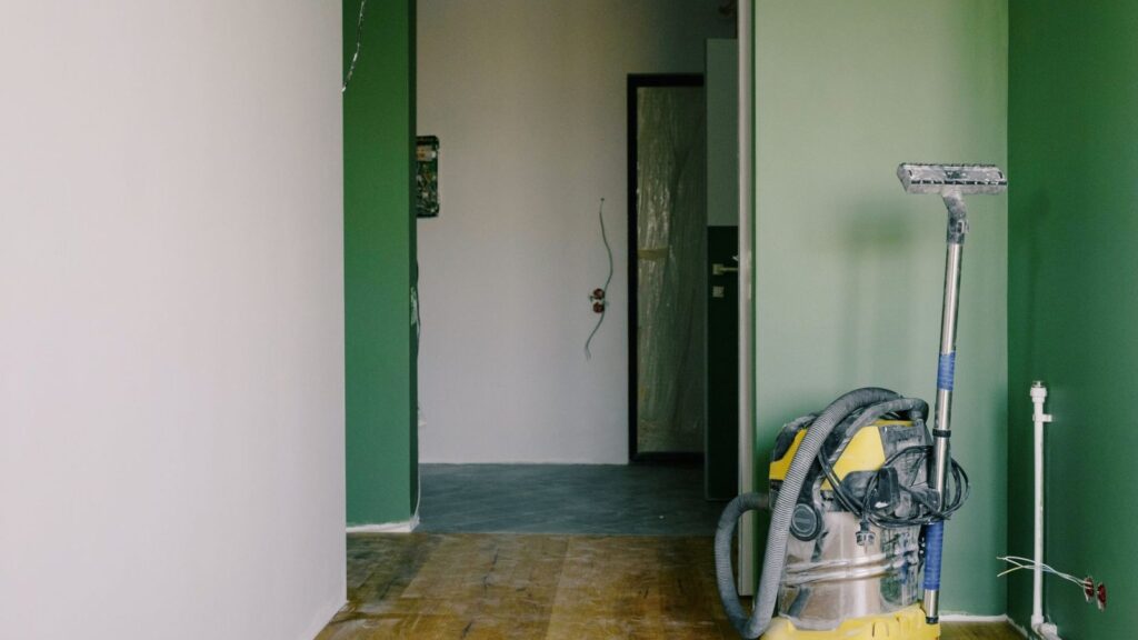 A technician inspects a vacuum cleaner at the elMeistrai service point in Vilnius, Žirmūnai