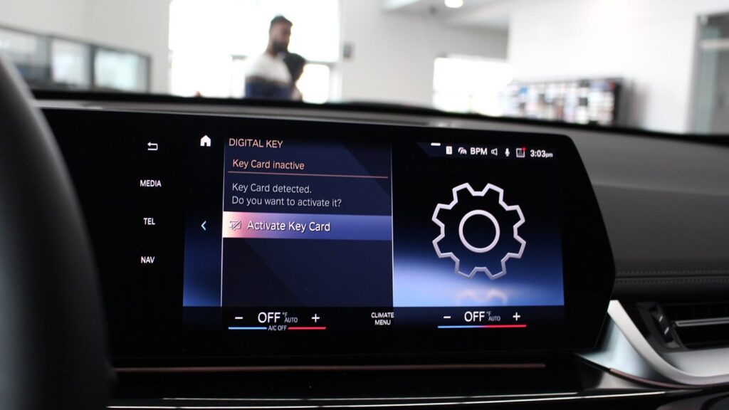 A technician updates the car's navigation maps