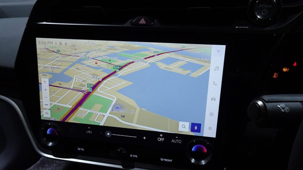 Navigation map DVD next to the car screen