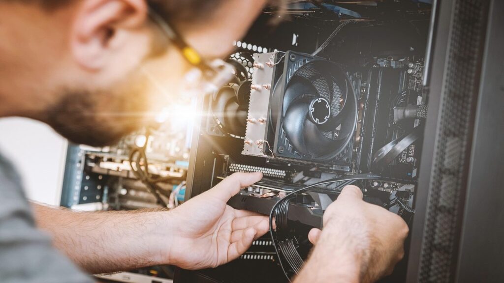 An opened desktop computer showing the cooling system and motherboard