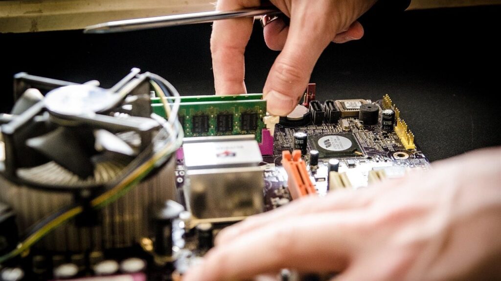Computer repair service in Klaipėda: a technician inspects a laptop